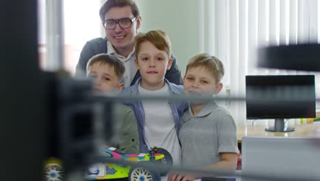 Boys-Posing-with-Toy-Car-Model