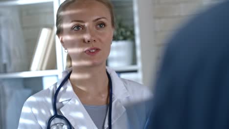 Female-Doctor-Chatting-with-Colleague