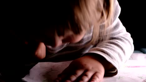 Little-girl-paining-on-a-sheet-of-paper,-throws-a-pencil---home-education.