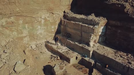 worker-is-drills-stones-with-using-pneumatic-tool-in-the-sand-quarry