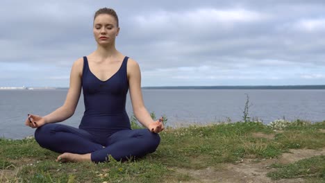 Pretty-woman-in-classical-yoga-pose,-energy-concentration