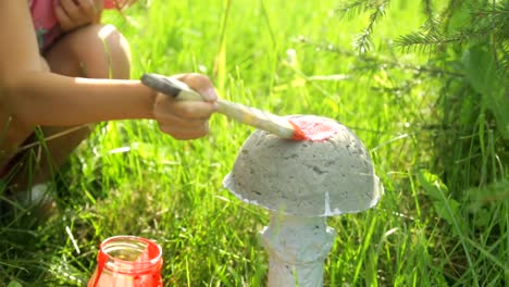 Little-girl-coloring-garden-decoration