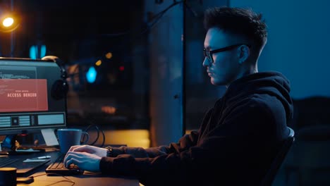 hacker-using-computer-for-cyber-attack-at-night