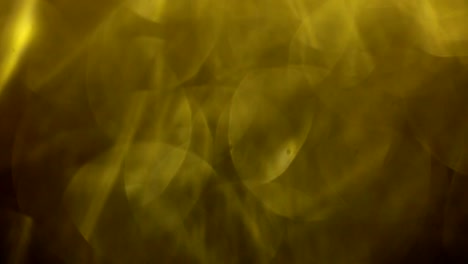 Yellow-colord-bokeh,-blurred-glass-particles.-Abstract-Motion-Background