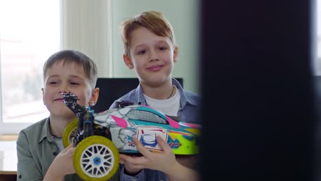 Boys-Holding-Toy-Car-and-Smiling