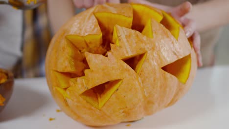Removing-Filling-from-Carved-Pumpkin