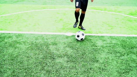 Football-players-practice-football-in-green-lawns.