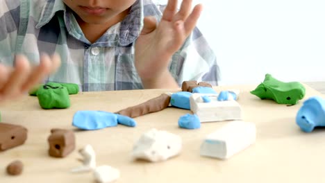 Child's-hands-playing-colorful-clay-on-table.-Development-of-fine-motor-skills-of-fingers-and-creativity,-education