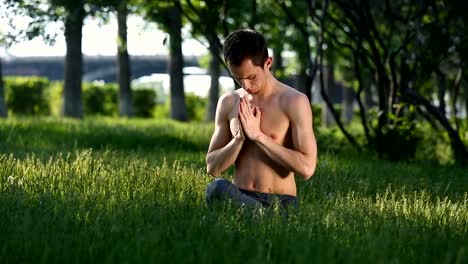 Young-slender-guy-is-meditating