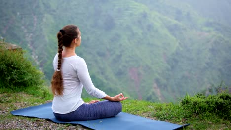 Woman-meditating-in-Lotus-asana