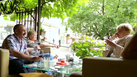 People-drinking-wine-in-street-cafe