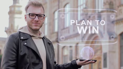 Smart-young-man-with-glasses-shows-a-conceptual-hologram-Plan-to-win