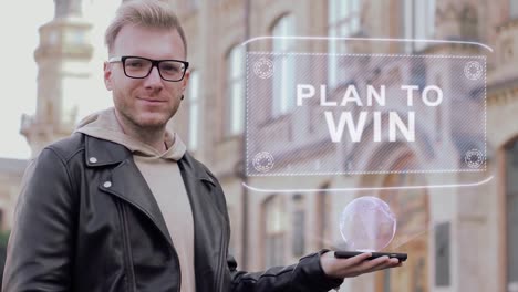 Kluger-junger-Mann-mit-Brille-zeigt-eine-konzeptionelle-Hologramm-Plan-zu-gewinnen