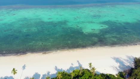 Aerial:-flying-over-tropical-beach-island-coral-reef-turquoise-caribbean-sea.-Indonesia-Moluccas-archipelago,-Kei-Islands,-Pasir-Panjang,-Banda-Sea.-Top-travel-destination,-best-diving-snorkeling,-stunning-panorama.