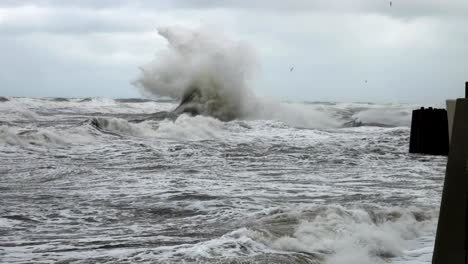 High-wave-breaking-on-the-rocks-of-the-coastline.-Extremely-Big-Wave-crushing-coast-,-Large-Ocean-Beautiful-Wave.-Super-Slow-Motion.