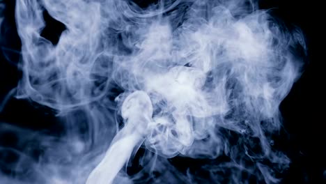 a-stream-of-white-smoke-or-steam-on-a-black-background