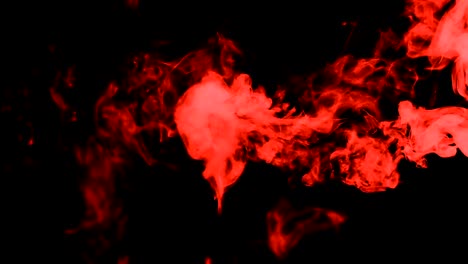 red-smoke-on-black-isolated-background