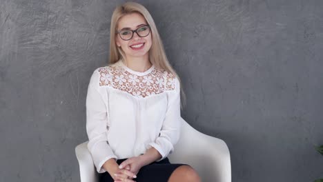 Businesswoman-sitting-on-chair