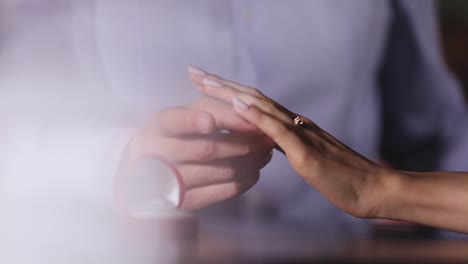 Marriage-Proposal.-Closeup-Man-Wearing-Ring-On-Woman's-Hand