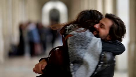 Cheerful-couple-hugging-and-spinning-outdoor.