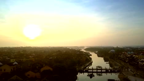 bright-orange-sky-above-dark-ancient-town-Hoi-An