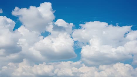 Timelapse-of-moving-clouds-and-blue-sky-in-summer-with-sunshine-in-day-time