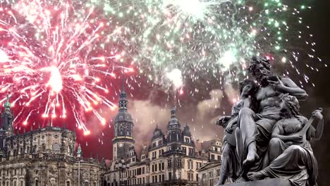 Sculpture-on-the-Bruhl-Terrace-and--Hofkirche-or-Cathedral-of-Holy-Trinity-and-holiday-fireworks---baroque-church-in-Dresden,-Sachsen,-Germany