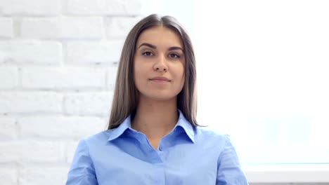 Portrait-of-Beautiful-Young-Woman-Waving-Finger-to-Refuse