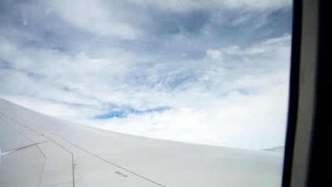 Wing-of-airplane-on-sky-and-cloud-on-moving