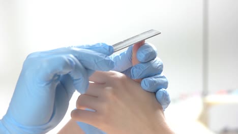 Manicurist-doing-manicure,-slow-motion.