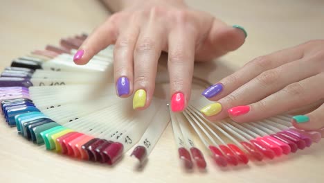 Hands-choosing-nail-color,-slow-motion.