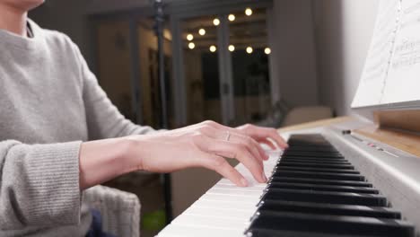 Hands-of-a-woman-playing-piano