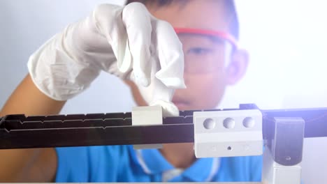 Cute-child-boy-study-science-in-laboratory-in-classroom