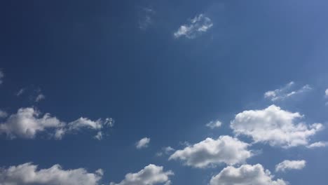 White-cloud-disappear-in-the-hot-sun-on-blue-sky.-Cumulus-clouds-form-against-a-brilliant-blue-sky.-Time-lapse-motion-clouds-blue-sky-background.