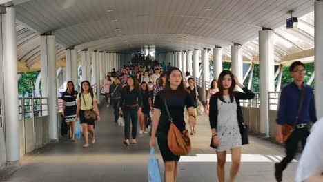 Time-Lapse-of-many-people-going-to-their-workplace-in-Bangkok-business-area-by-using-public-mass-transit-system-at-Chong-nonsi-BTS-station-in-morning-rush-hour.