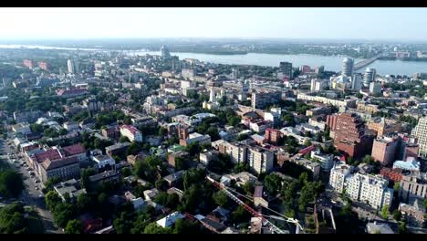 Panoramic-view-of-the-old-town-near-the-river,-a-Soviet-built-city-near-the-river-from-the-air