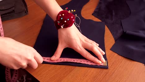 The-seamstress-measures-with-a-centimeter-tape