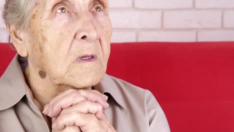 An-elderly-woman-prays.