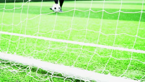 Jugadores-de-fútbol-practican-fútbol-en-césped-verde.