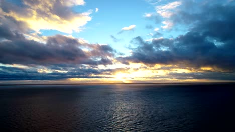 The-flight-above-the-water-on-the-beautiful-sunrise-background