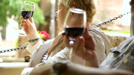 Woman-drinking-wine-in-street-cafe