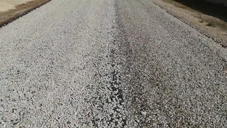 newly-constructed-asphalt-road-works,-pitch-and-road