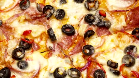Rustic-italian-pizza-with-pepperoni,-mozzarella-and-olive