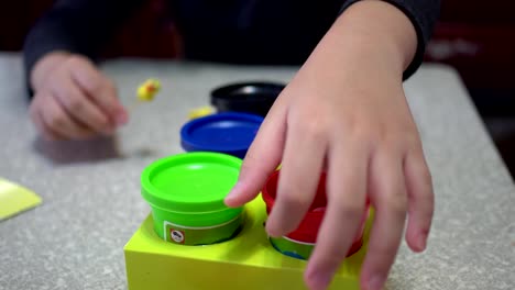 A-child-playing-with-clay.