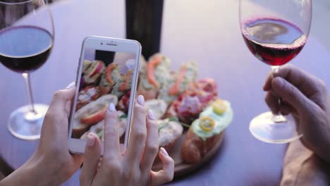 Food-And-Drink-Photo.-Woman-Looking-At-Pictures-On-Phone-Screen