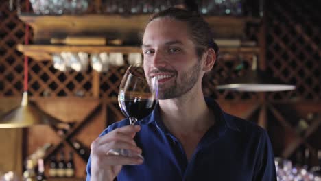 Man-Drinking-Red-Wine-From-Glass-At-Winery-Restaurant