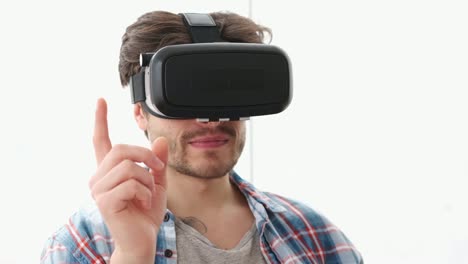 Young-man-using-virtual-reality-simulator