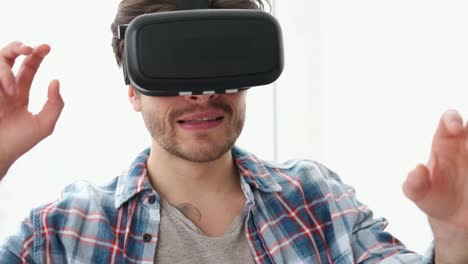 Man-having-fun-playing-game-on-virtual-reality-headset