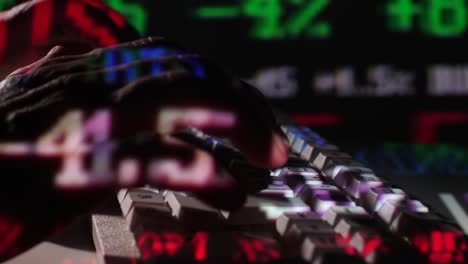 Close-Up-Typing-on-Keyboard-with-Stock-Exchange-Board-Projection