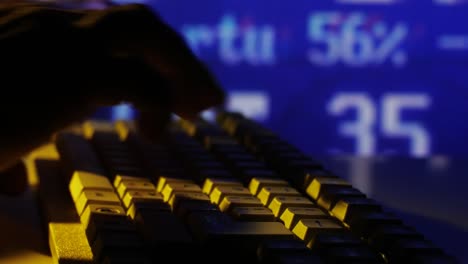 Male-Hands-Typing-on-Keyboard-Stock-Exchange-Board-Background